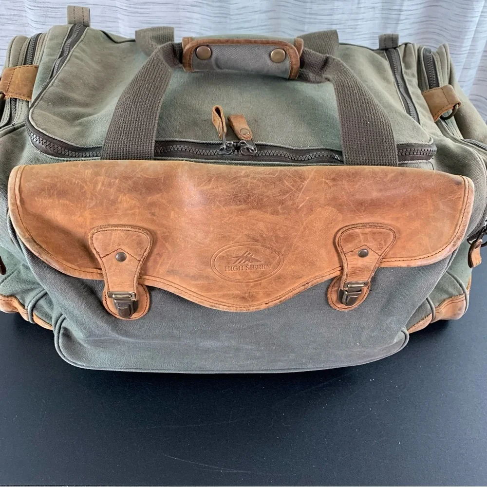 High Sierra Green canvas and Brown leather Duffel Bag.